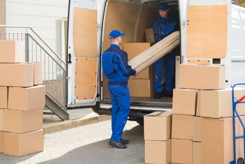 Removal team preparing a move on a residential street in Holland Park