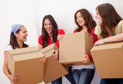 Professional piano removals in Hollandpark with a carefully protected upright piano