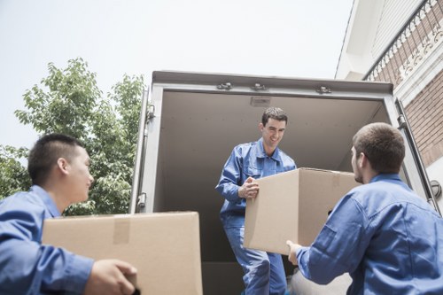 Team reviewing modern slavery compliance documents at Hollandpark Removals