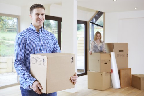 Moving boxes and protected furniture during a Holland Park relocation