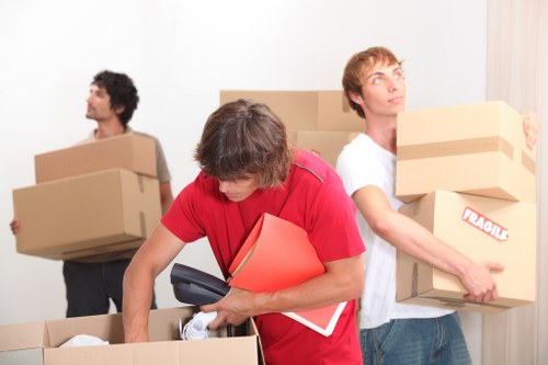 Commercial movers transporting office items near Holland Park