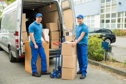 Packed moving boxes and furniture prepared for transport