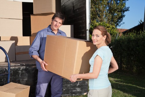 Professional movers handling furniture in a Hollandpark home