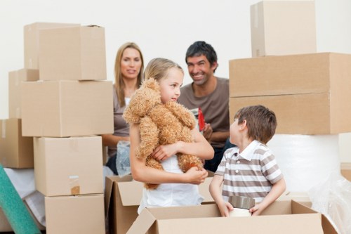 Moving crew handling furniture carefully inside a property